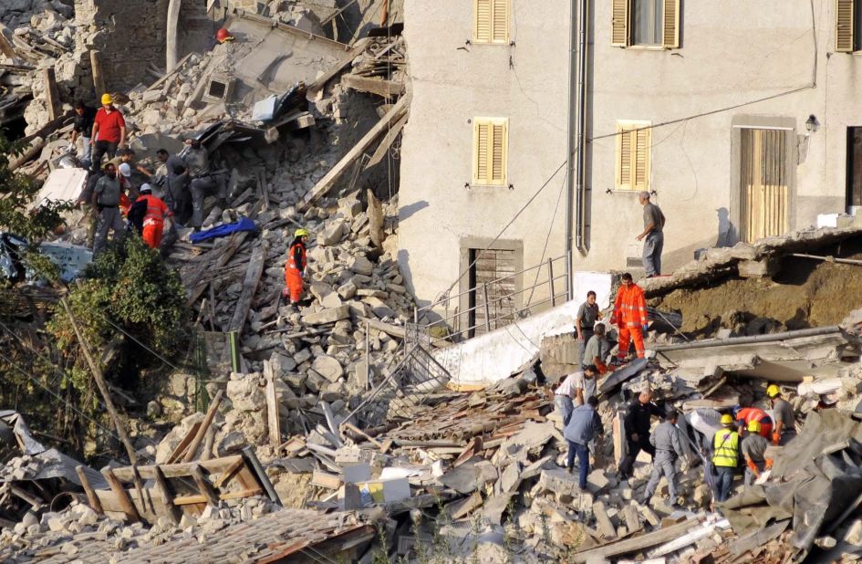 Search-and-rescue teams look for survivors in Pescara del Tronto.
