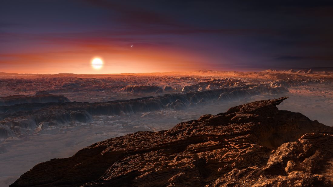 This artist's impression shows a view of the surface of the planet Proxima b orbiting the red dwarf star Proxima Centauri, the closest star to the Solar System. Proxima b is a little more massive than the Earth.