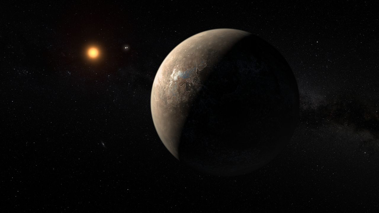 This artist's impression shows the planet Proxima b orbiting the red dwarf star Proxima Centauri, the closest star to our solar system.