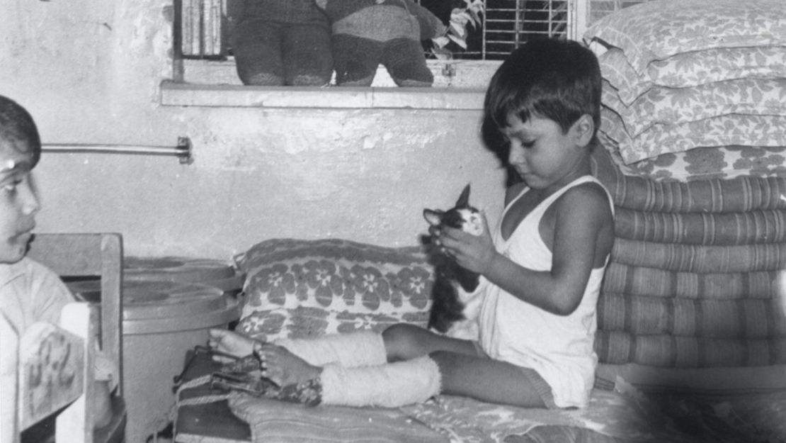 As a child, Lewis had to crawl because polio affected the use of his legs. He remembers Mother Teresa as a towering figure even though she was tiny.