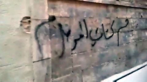 The Mosul Battalions' members risk torture or death to leave signs of their resistance on the city's walls.