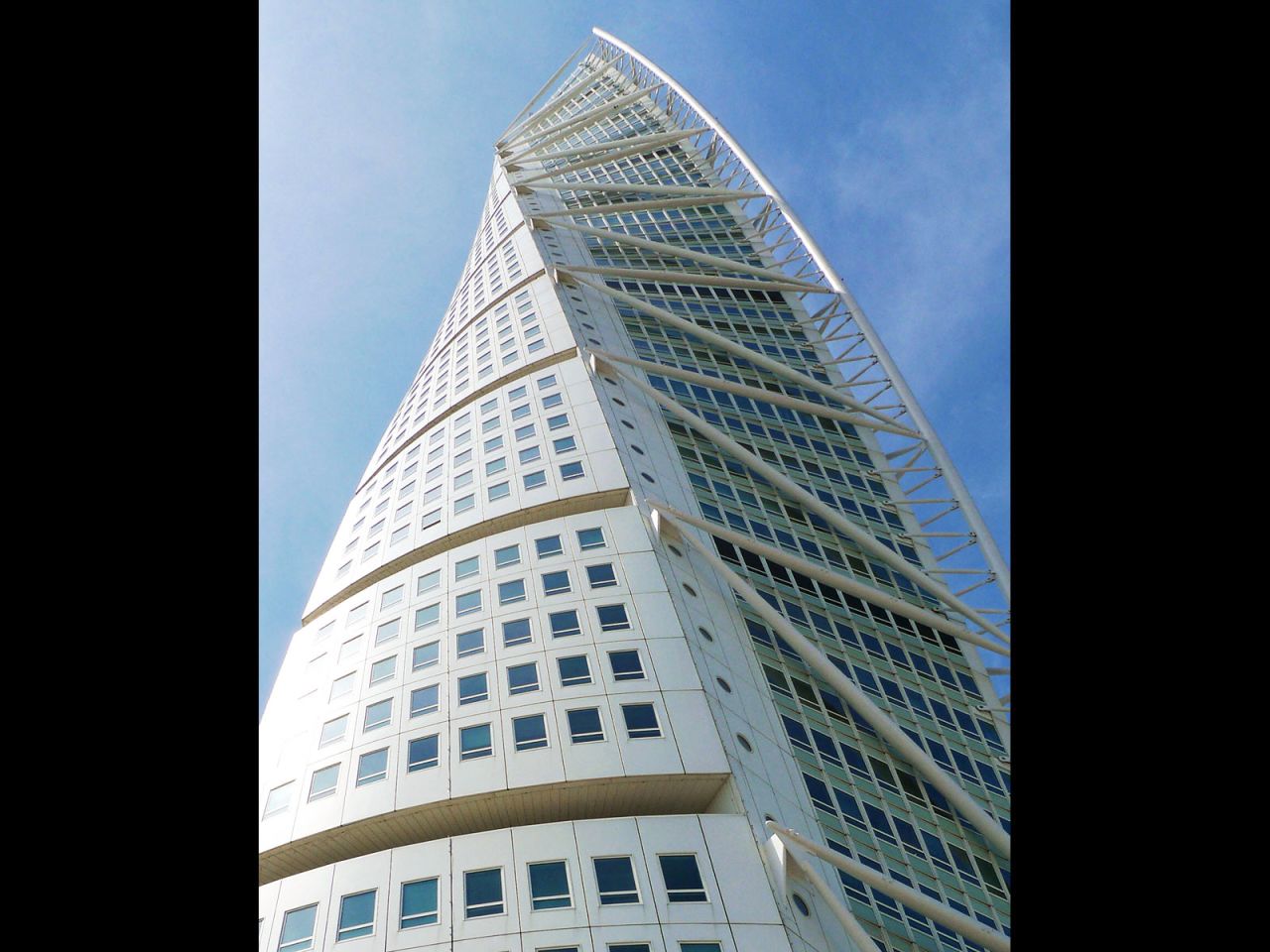 "The unconventional form of a twisting building means every component of tall building design must be rethought," says the CTBUH report author, Shawn Ursini. 