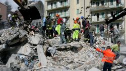 Rescue workers search for bodies amongst the rubble of a destroyed building on April 6, 2009 in L'Aquila, Italy. The 6.3 magnitude earthquake tore through central Italy, devastating historic mountain towns, killing at least 90 people and injuring some 1500. 