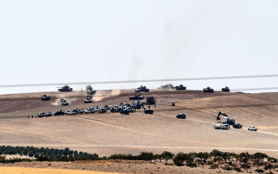 Turkish tanks and allied Syrian rebels move along the border Wednesday.
