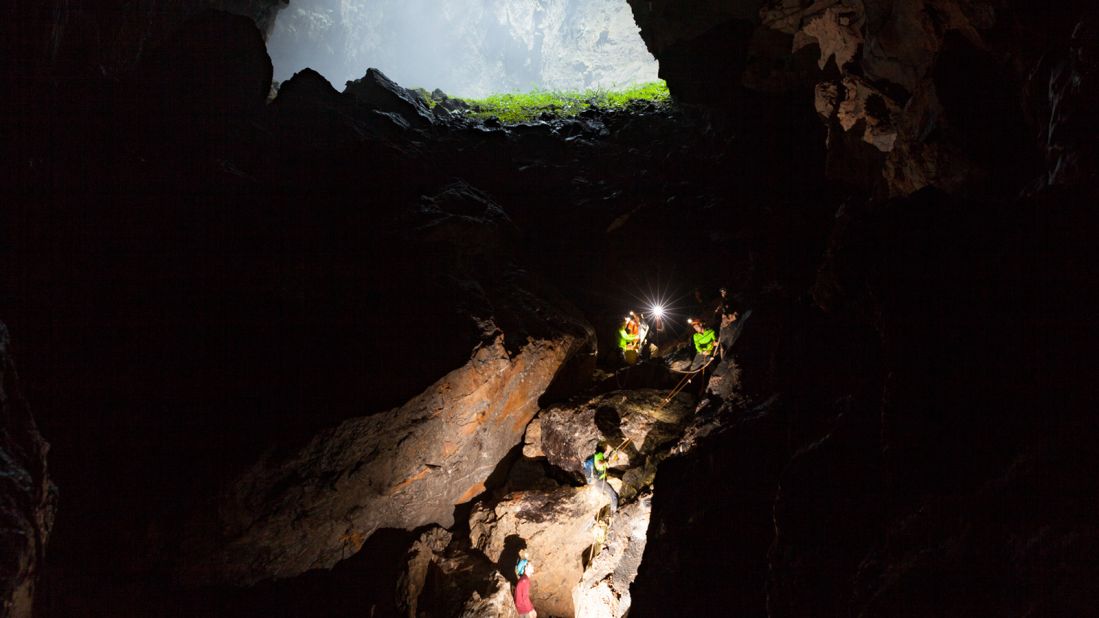 <strong>Abseiling into darkness: </strong>Sections of Hang Son Doong are so steep and perilous that ropes are required to help lower people safely through them.