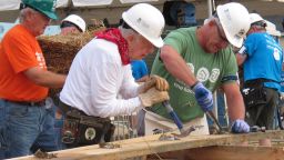 Former President Jimmy Carter, center, works on a Habitat for Humanity construction project in Memphis.