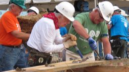 Former President Jimmy Carter, center, works on a Habitat for Humanity construction project on Monday, Aug. 22, 2016 in Memphis, Tenn. On Monday, Carter said he thought he had just a few weeks to live during his battle with cancer a year ago. "Now I feel pretty certain about my cure and the cancer being in remission, but the doctors are still keeping an eye on me," he said. (AP Photo/Adrian Sainz)