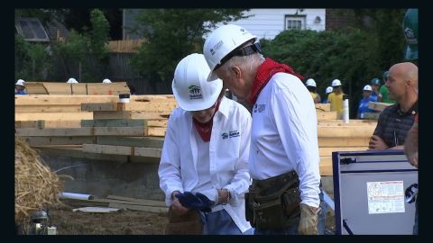 Jimmy Carter and his wife, Rosalynn Carter, work in Memphis.