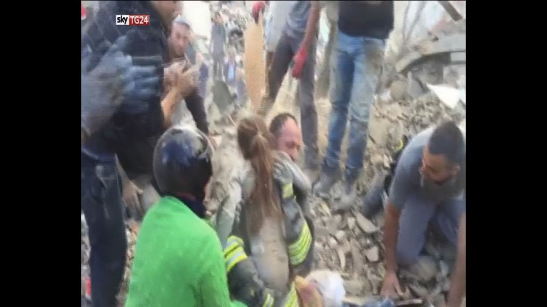 An 8-year-old girl is rescued from the debris of a collapsed building in Pescara del Tronto.