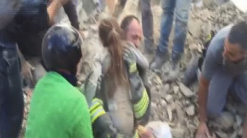 An 8-year-old girl is rescued from the debris of a collapsed building in Pescara del Tronto.