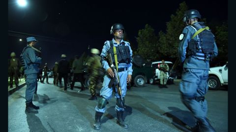 Security personnel stand guard Wednesday night at the American University of Afghanistan in Kabul.
