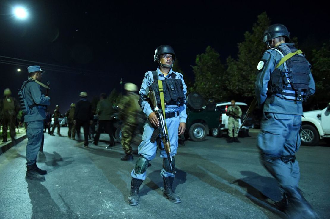 Security personnel stand guard Wednesday night at the American University of Afghanistan in Kabul.
