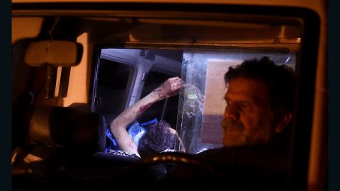 An injured Afghan man lies on a stretcher in an ambulance after Wednesday night's attack.