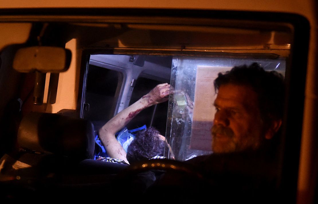 An injured Afghan man lies on a stretcher in an ambulance after Wednesday night's attack.