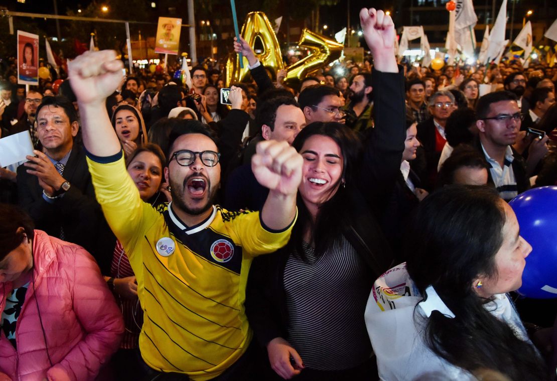 Colombians celebrate in their capital, Bogota, as the deal is signed.