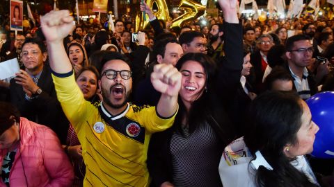Colombians celebrate in their capital, Bogota, as the deal is signed.