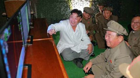 North Korean leader Kim Jong Un oversees the testing of a submarine launched ballistic missile test.