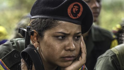 A FARC guerrilla listens during a class on the peace process and how life will be in the future.
