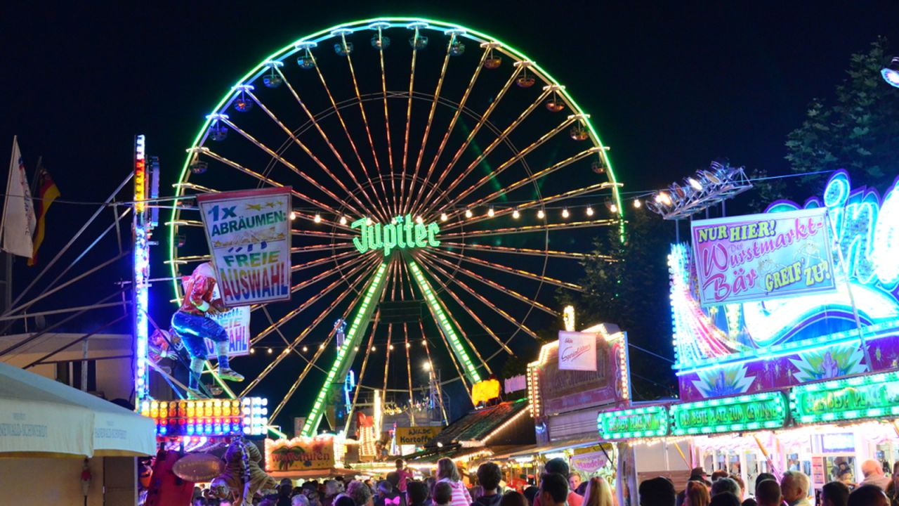 The Jupiter Ferris wheel carries passengers 50 meters up over the festival.