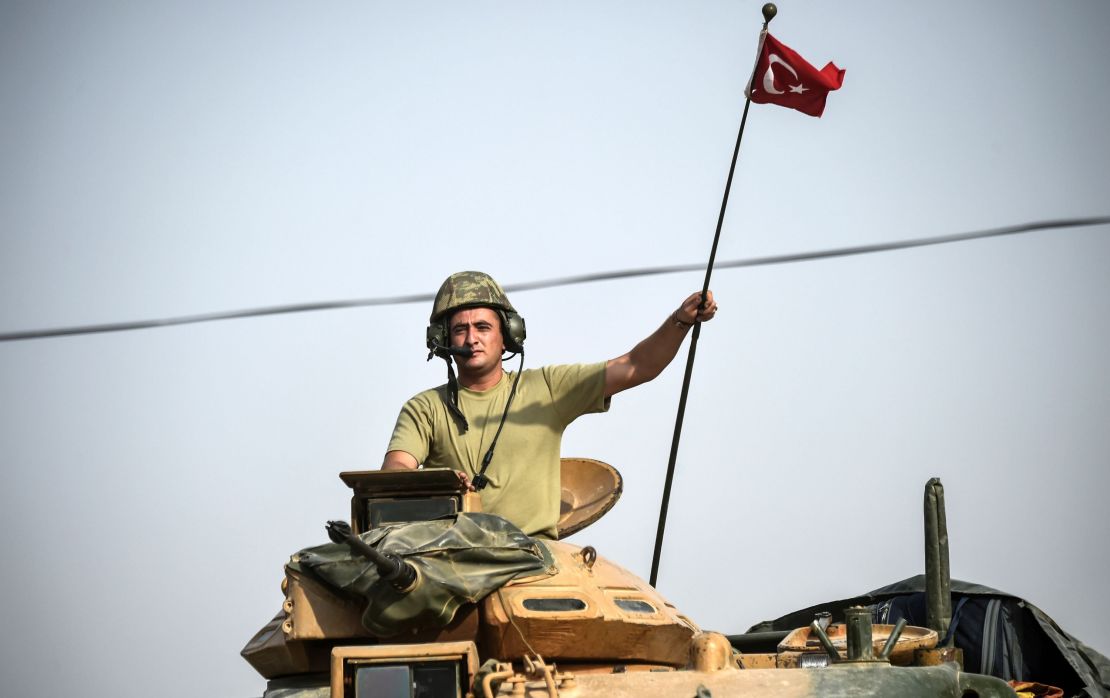 Turkish tanks near Karkamıs head toward the Syrian town of Jarabulus in August.