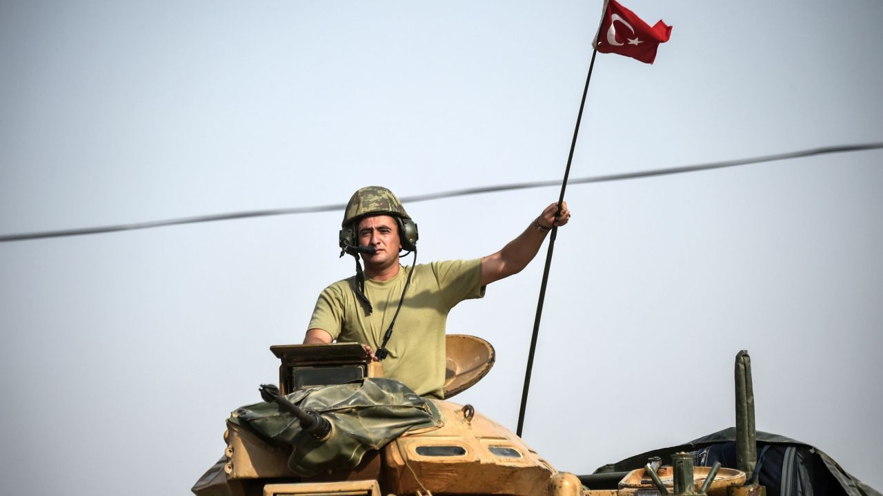 Turkish tanks near Karkamıs head toward the Syrian town of Jarabulus in August.
