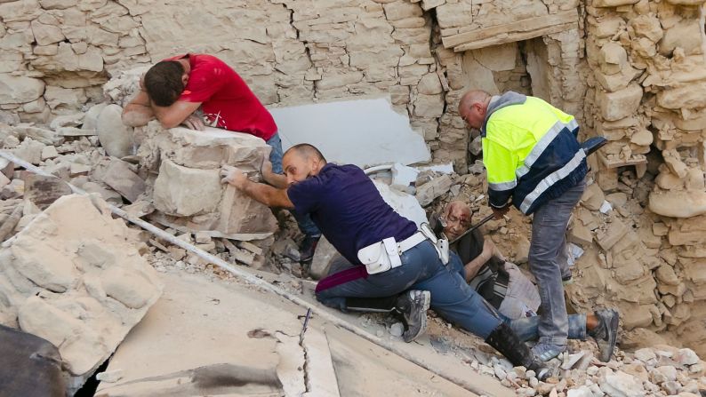 A man, in red, cries as his friend is pulled from the rubble after a 6.2-magnitude earthquake in Amatrice, Italy, on Wednesday, August 24. The earthquake -- which killed at least 250 people and injured more than 360 -- devastated towns across central Italy, leaving rescuers on a <a href="http://www.cnn.com/2016/08/25/europe/italy-earthquake/" target="_blank">desperate search for survivors</a>.