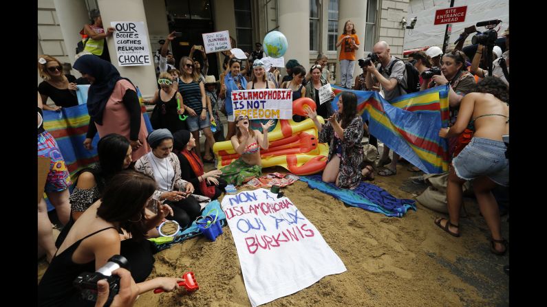 People protest outside the French Embassy in London on Thursday, August 25, in response to some French authorities' decision to <a href="http://www.cnn.com/2016/08/24/europe/woman-burkini-nice-beach-incident-trnd/" target="_blank">ban women from wearing burkinis on the beach</a>. The French Council of State <a href="http://edition.cnn.com/2016/08/26/europe/france-burkini-ban-court-ruling/index.html" target="_blank">suspended the ban</a> on Friday, August 26, ruling that French mayors do not have the right to ban burkinis -- swimsuits that cover the whole body except for the face, hands and feet.
