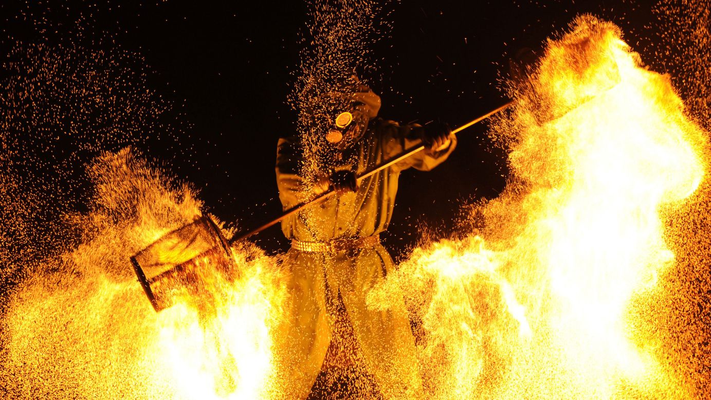 A fire artist performs during the Minsk International Fire Fest in Ratomka, Belarus, on Friday, August 19.