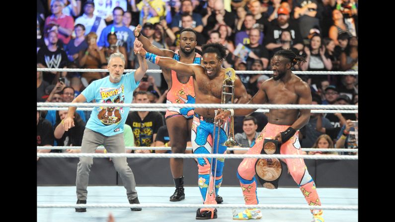 Jon Stewart, left, joins wrestlers Big E, Xavier Woods and Kofi Kingston in the ring at WWE SummerSlam at the Barclays Center in New York on Sunday, August 21.
