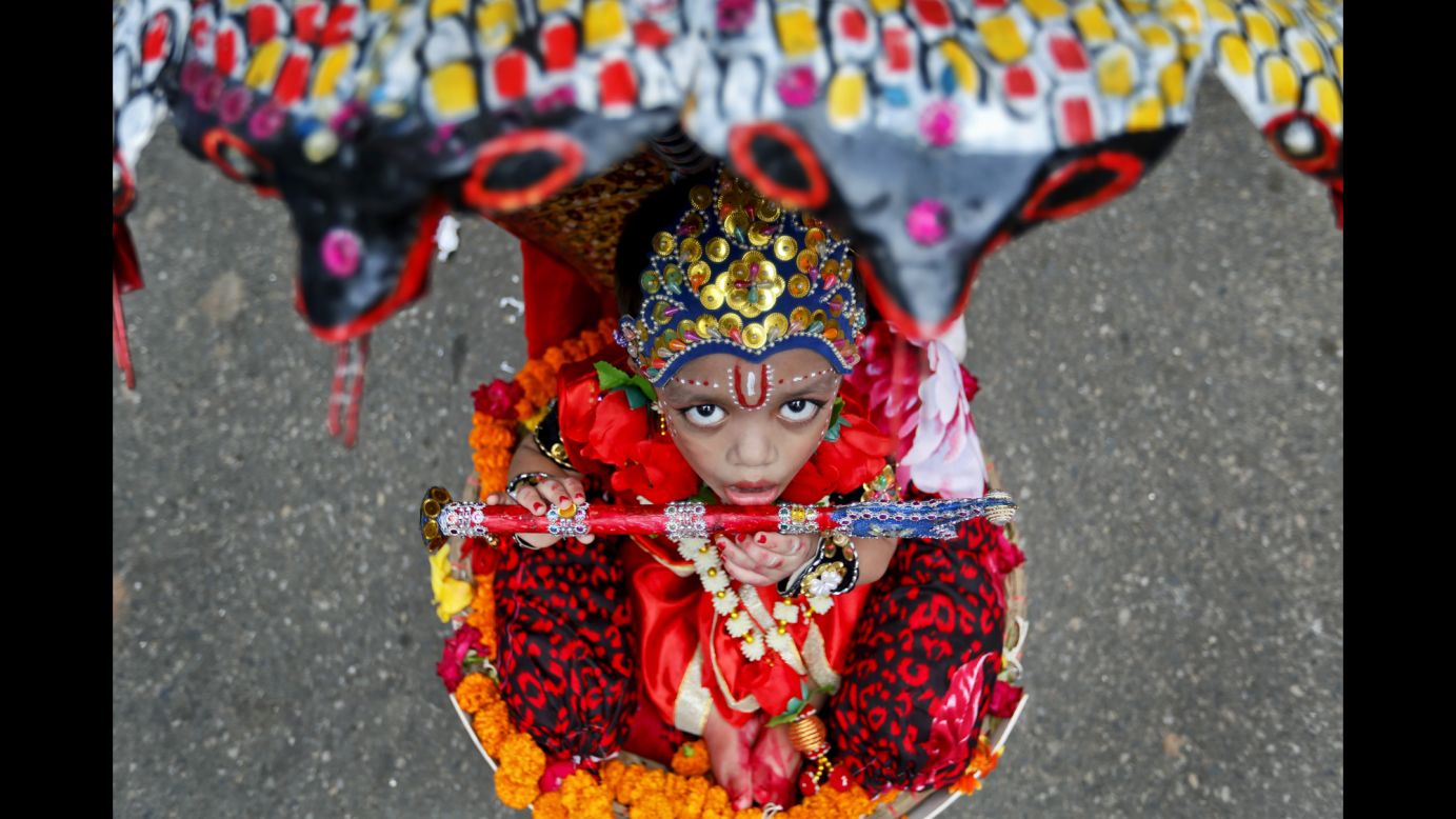A child participates in a procession to celebrate Janmashtami in Dhaka, Bangladesh, on Thursday, August 25. The festival marks the birth of the Hindu God Krishna.