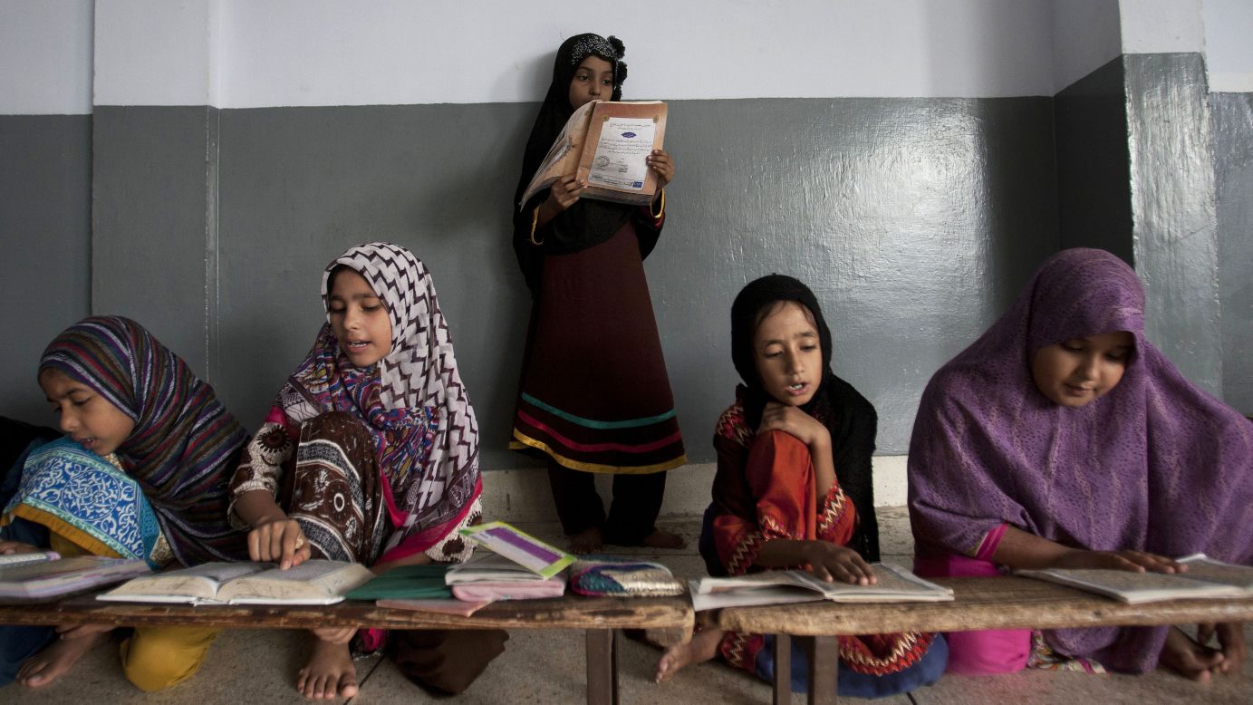 Girls recite verses of the Quran, the holy book of Islam, at a seminary in Karachi, Pakistan, on Saturday, August 20.