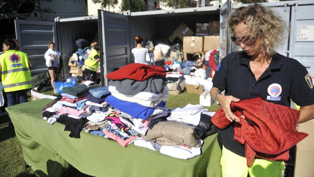 Emergency team members set up a tent camp for earthquake victims at a sports field in Arquata del Tronto on August 26.