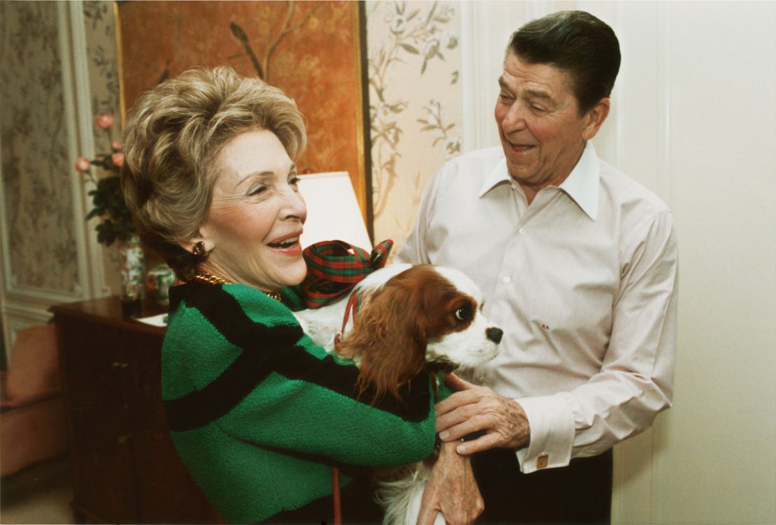 Reagan presents first lady Nancy Reagan with Rex at their suite in a New York City hotel on December 6, 1985.