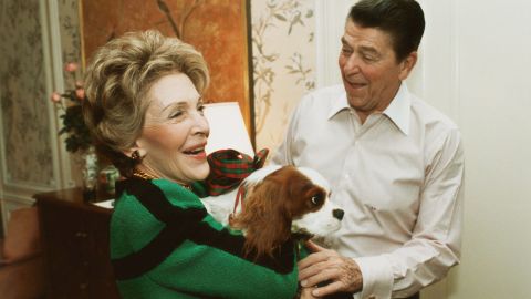 Reagan presents first lady Nancy Reagan with Rex at their suite in a New York City hotel on December 6, 1985.