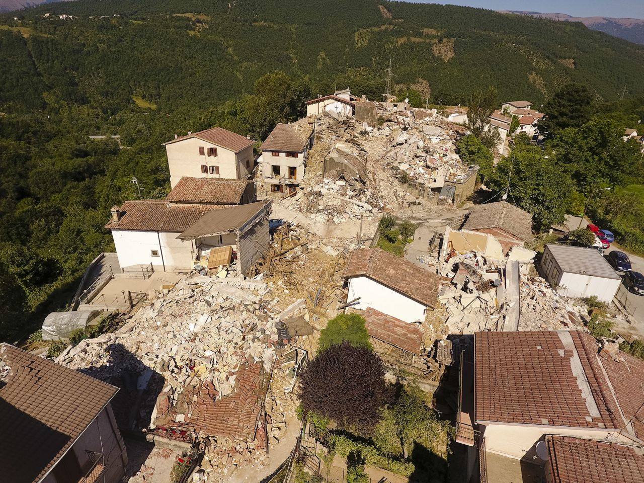 An aerial view shows the damage in the village of Saletta on August 26. Strong aftershocks in the region have rattled residents and emergency crews.