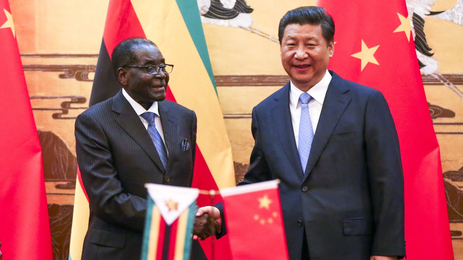 Mugabe and Chinese President Xi Jinping participate in a signing ceremony in Beijing in 2014. 