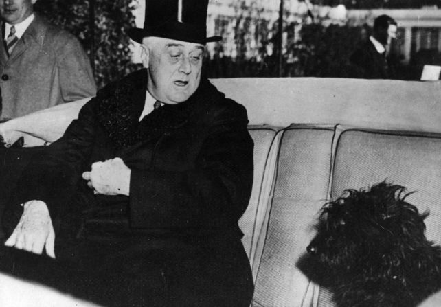 President Franklin Delano Roosevelt sits in his car with his Scottish terrier, Fala, on February 7, 1941.