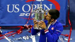 NEW YORK, NY - SEPTEMBER 13:  Novak Djokovic of Serbia celebrates with the winner's trophy after defeating Roger Federer of Switzerland during their Men's Singles Final match on Day Fourteen of the 2015 US Open at the USTA Billie Jean King National Tennis Center on September 13, 2015 in the Flushing neighborhood of the Queens borough of New York City. Djokovic defeated Federer 6-4, 5-7, 6-4, 6-4.  (Photo by Maddie Meyer/Getty Images)