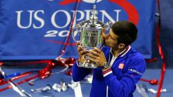 NEW YORK, NY - SEPTEMBER 13:  Novak Djokovic of Serbia celebrates with the winner's trophy after defeating Roger Federer of Switzerland during their Men's Singles Final match on Day Fourteen of the 2015 US Open at the USTA Billie Jean King National Tennis Center on September 13, 2015 in the Flushing neighborhood of the Queens borough of New York City. Djokovic defeated Federer 6-4, 5-7, 6-4, 6-4.  (Photo by Maddie Meyer/Getty Images)
