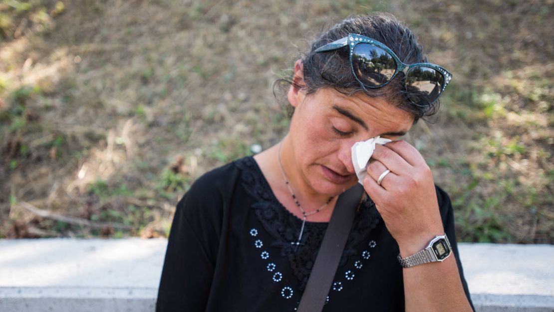 Cecilia d'Alessio takes a moment to grieve for three family members who died in the earthquake in Amatrice. She owns a home in Amatrice city center which she says has now been destroyed. 