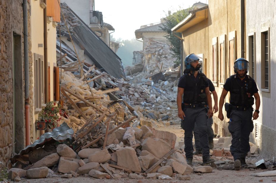 Police inspect rubble and debris in Amatrice, Italy, on August 27.