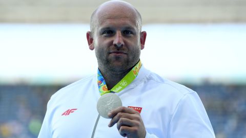 Silver medalist Piotr Malachowski decided to auction off his medal after learning about a little boy's battle with eye cancer. 