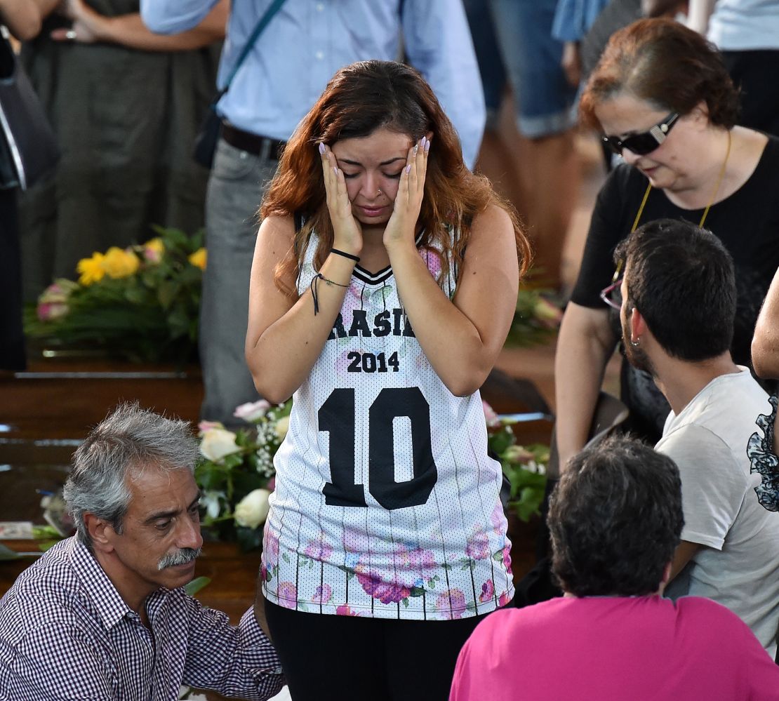 Some of the mourners at a state funeral for Italy's earthquake victims were clearly in shock as they said goodbye to victims.