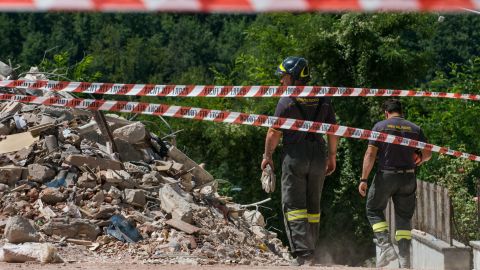 Emergency personnel survey a cordoned-off area in the center of Amatrice. Much of the town is now inaccessible to everyone but authorities.
