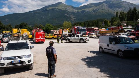 Three days on, various emergency response groups congregate in an open area in Amatrice. Rescuers were initially hindered by the lack of access to the mountain town.
