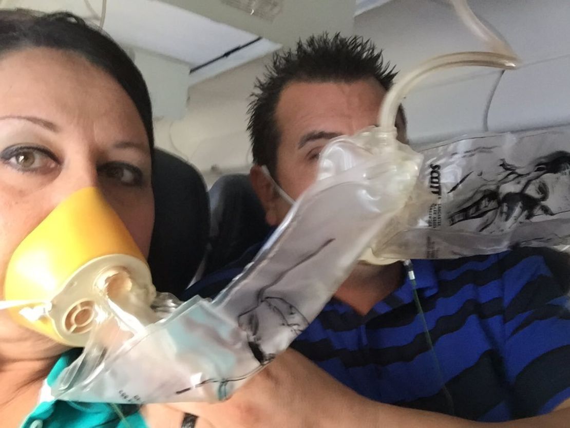 Passangers used oxygen masks as the airliner with 104 people aboard descended.