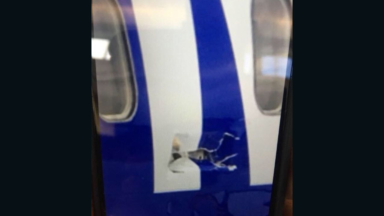 There was damage to the left side of the plane just above the wing.