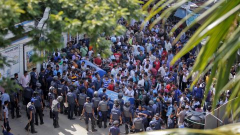 A crowd gathered near the scene of the raid. Police staged an hour-long gun battle before shooting dead three suspected militants.