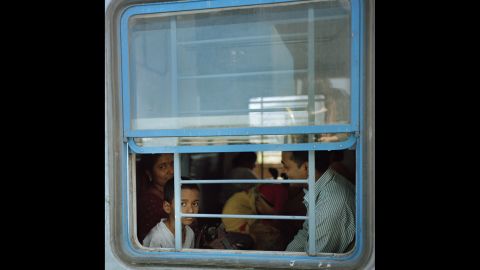 A boy peers out of a window while his family travels by train in the southern Indian state of Kerala. Photographer Sara Hylton spent months traveling India's vast railway system. She said "the thing that stands out to me most about Indian trains is their intensity. ... Their scope and their culture is so much more intense than what I experienced on other trains. Everything feels multiplied."
