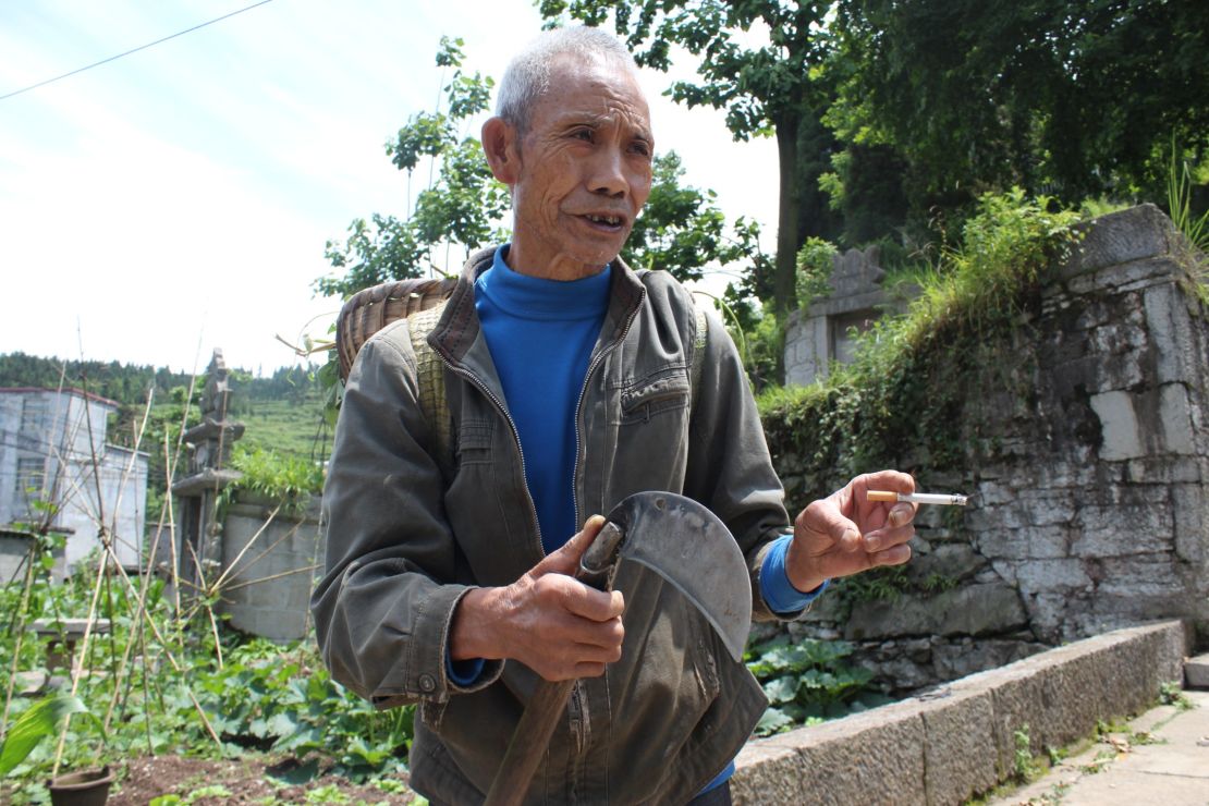 Farmer Yang Xuekun still uses the road to head into the mountains.